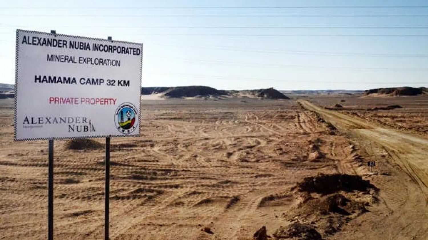 File photo showing a sign marking the turn-off leading to the Hamama gold exploration site, deep in the desert east of Luxor, Egypt. (AP)
