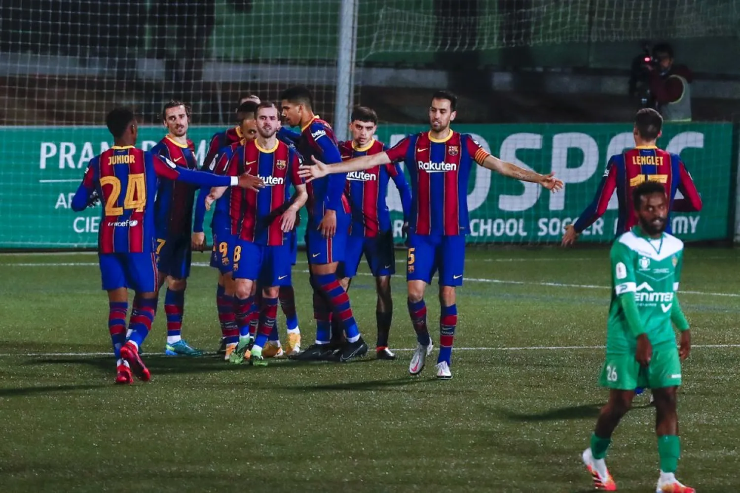 Barcelona players celebrate after Ousmane Dembele scored his side's first goal during a Copa del Rey match against Cornella at the Nou Municipal stadium in Cornella, Spain, Jan. 21, 2021. (AP)