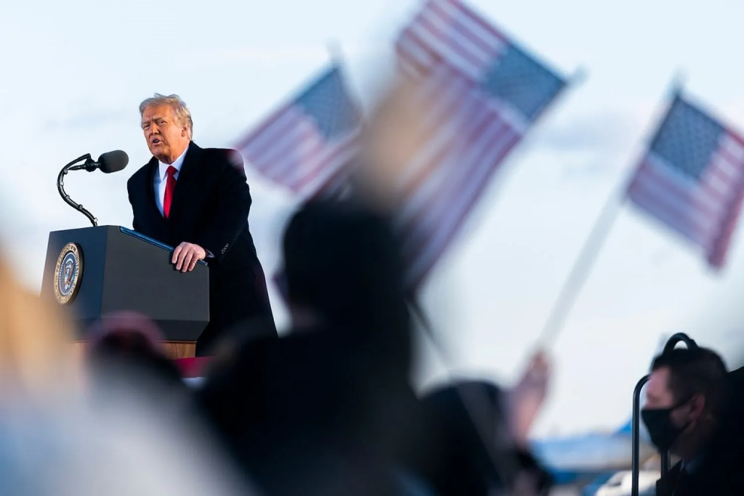 Donald Trump speaks before boarding Air Force One at Andrews Air Force Base, Jan 20. (AP)