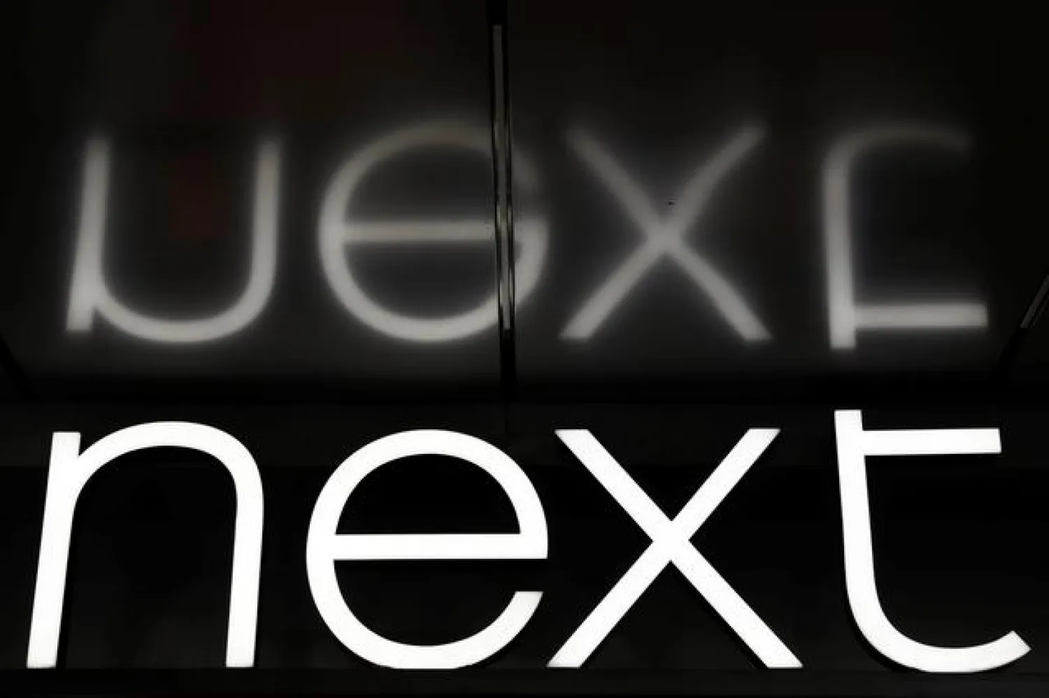FILE PHOTO: A Next logo is seen outside a store in central London, Britain January 3, 2017. Picture taken January 3, 2017. REUTERS/Stefan Wermuth/File Photo