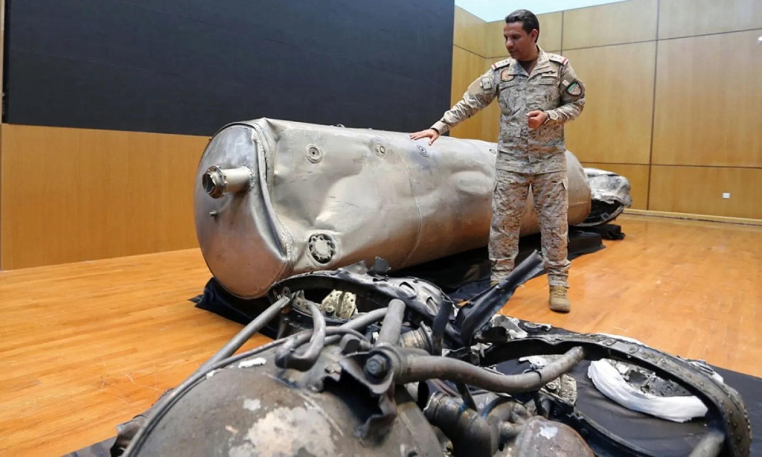 Turki al-Malki, a spokesman for the Saudi-led coalition, displays debris from a ballistic missile launched by the Houthis towards Riyadh. (Reuters file photo)