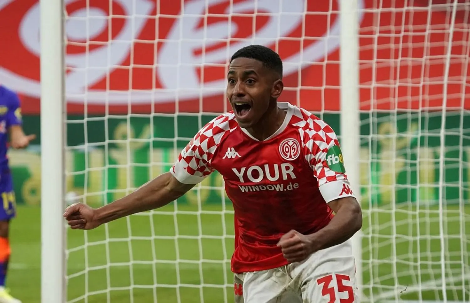 Barreiro Martins from Mainz celebrates after scoring his side third goal during the German Bundesliga match between FSV Mainz 05 and RB Leipzig in Mainz, Germany, Jan. 23, 2021. (AP)