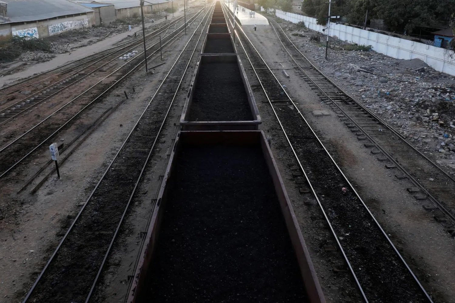 FILE PHOTO: A cargo train loaded with coal dust, moves past the port area near City Station in Karachi, Pakistan September 24, 2018. REUTERS/Akhtar Soomro/File Photo