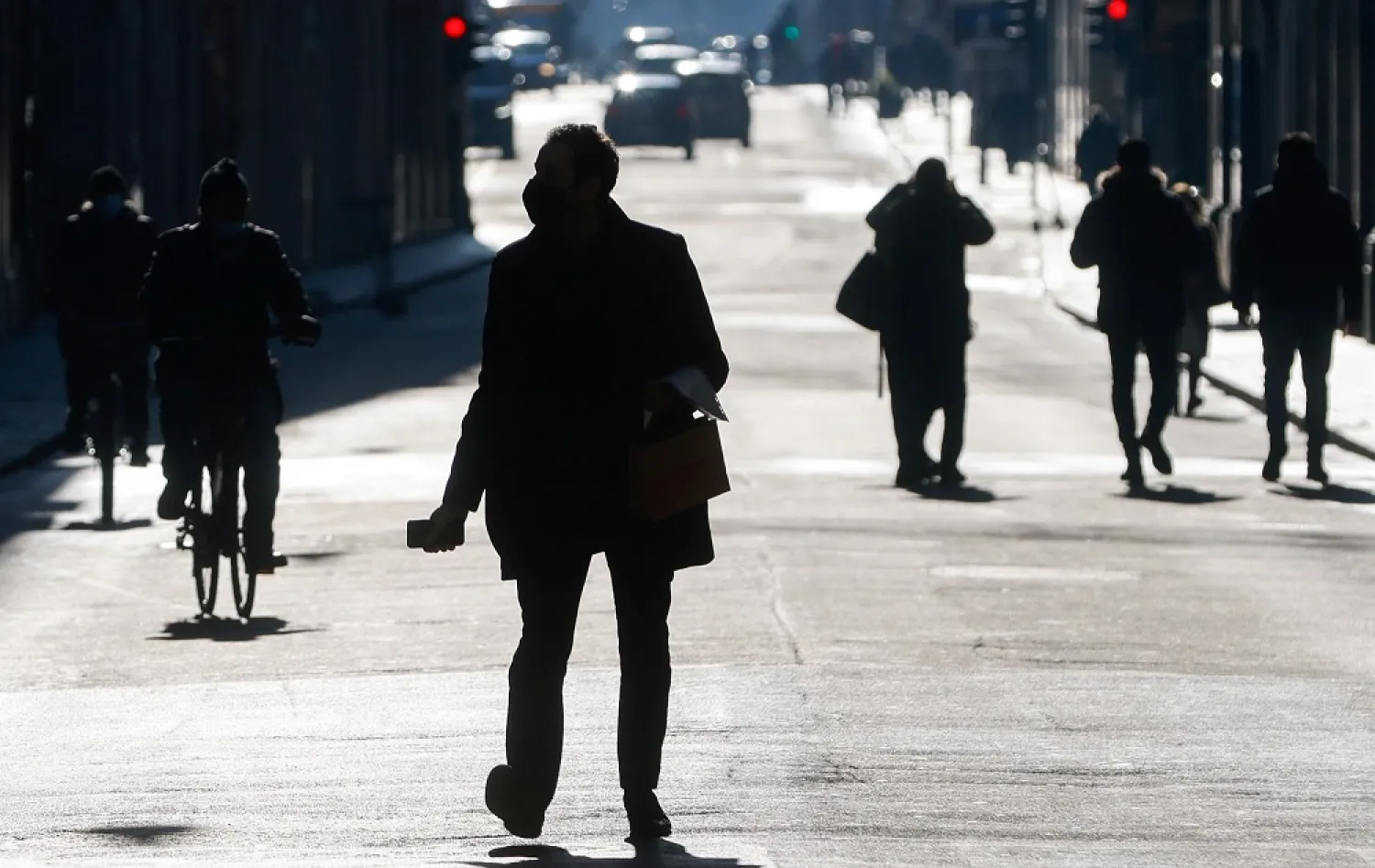 People seen at Via del Corso street, as Italy goes back to lockdown as part of efforts put in place to curb the spread of the coronavirus, in Rome, Italy, Dec. 31, 2020. (Reuters)