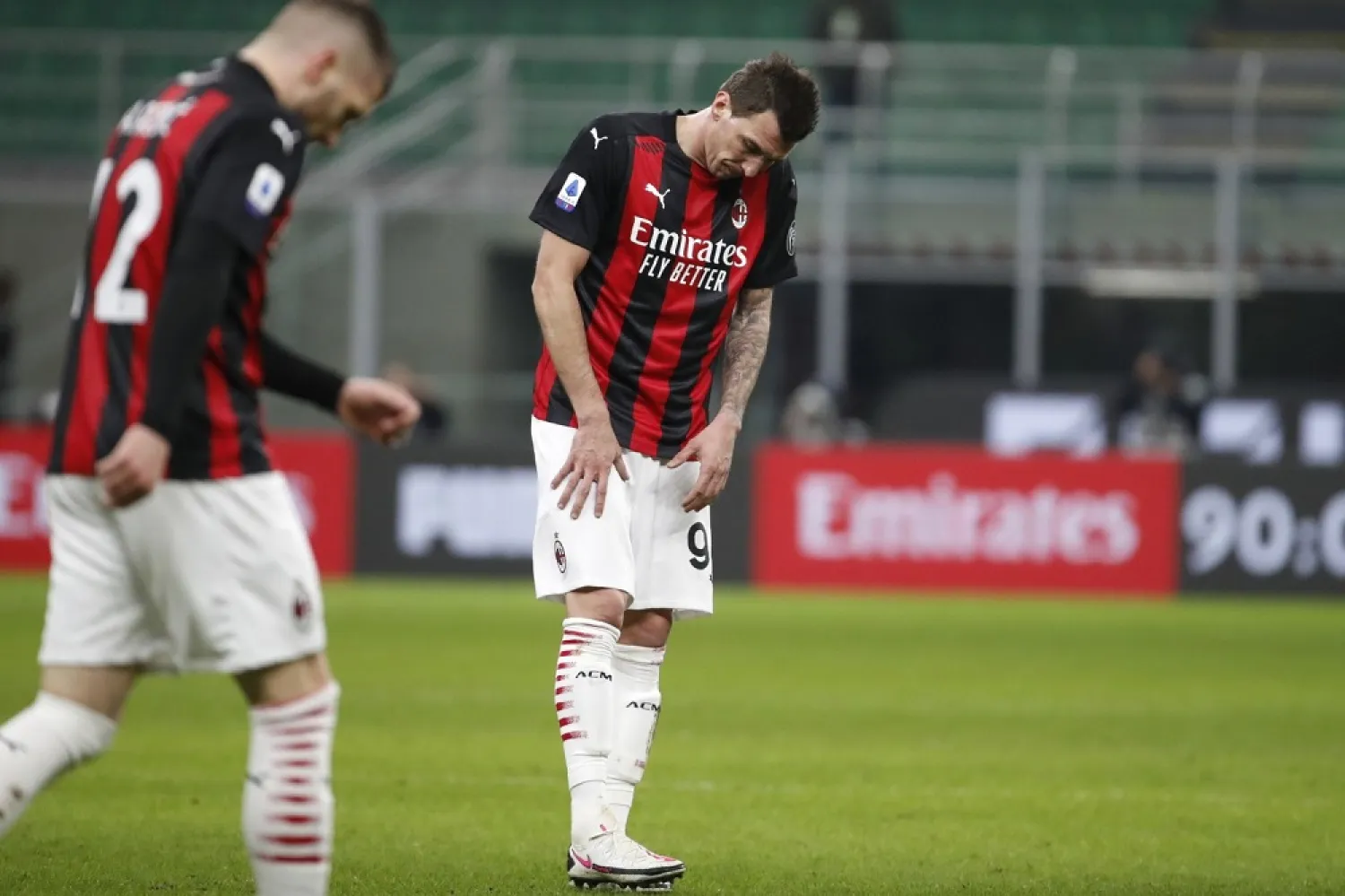 AC Milan’s Mario Mandzukic, center, reacts after missing a scoring chance during the Serie A match between AC Milan and Atalanta at the Milan San Siro Stadium, Italy, Jan. 23, 2021. (AP)
