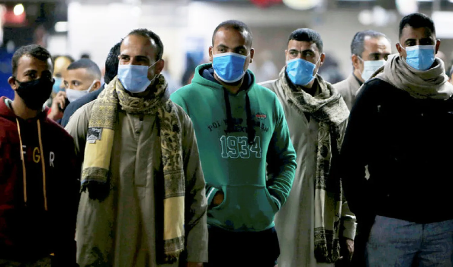 Men in protective masks wait for the train at a metro station in Cairo. Reuters file photo