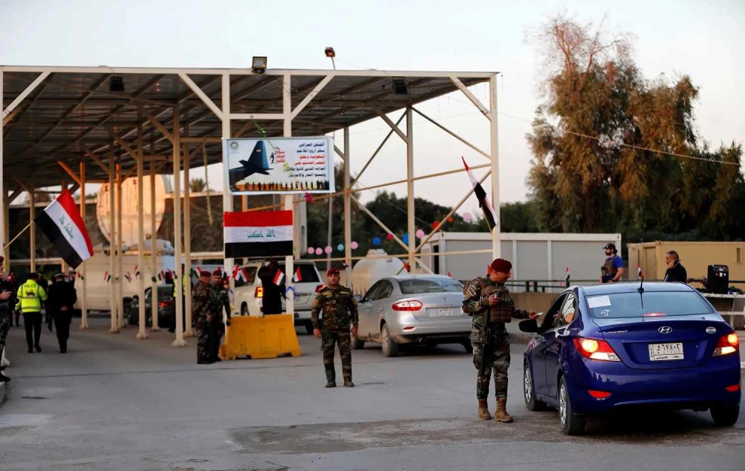 Iraqi security forces gather at a checkpoint into the Green Zone in Baghdad, Dec. 10, 2018. (Reuters)