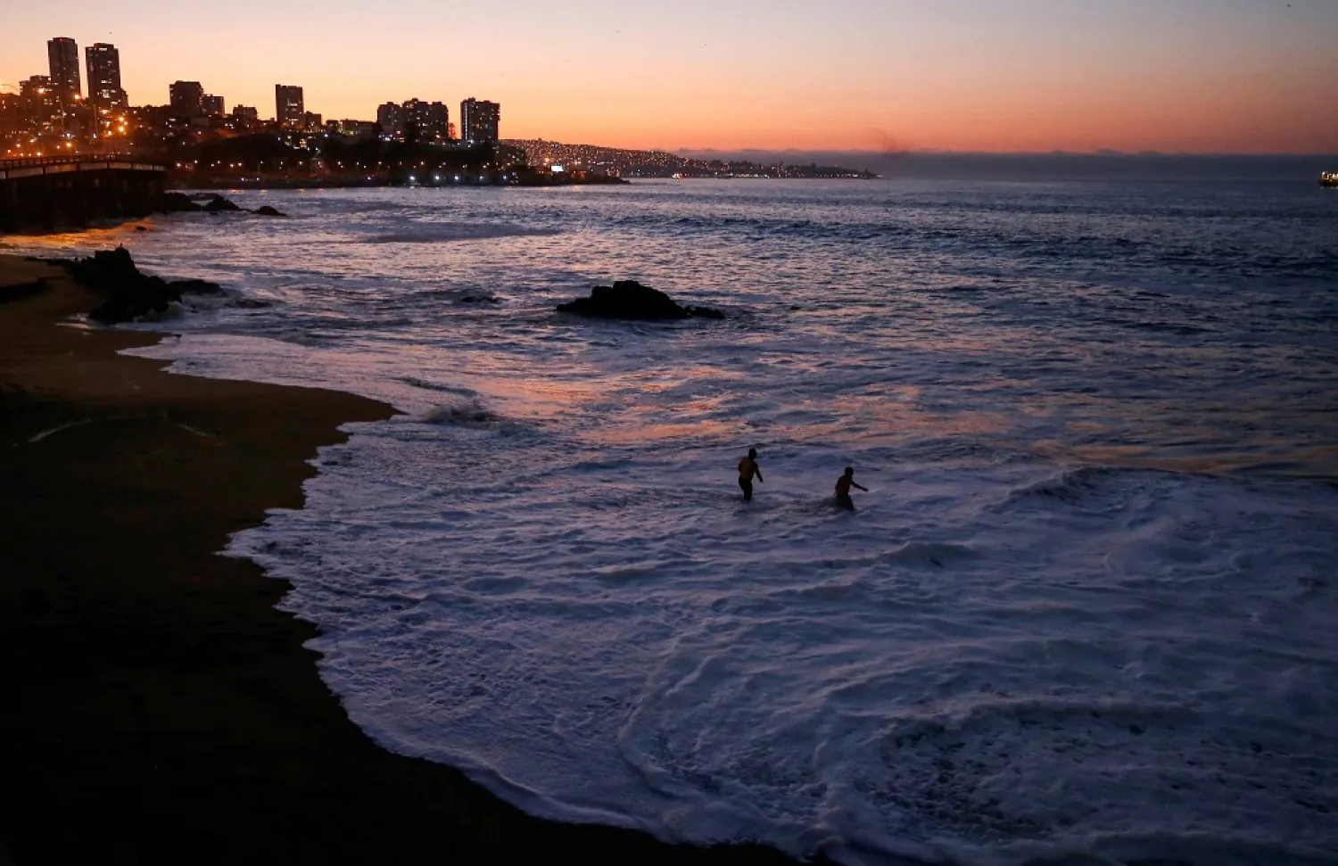 Some people in Chile received the tsunami evacuation message on their cellphones by mistake, which authorities attributed to a technical error. (Reuters)