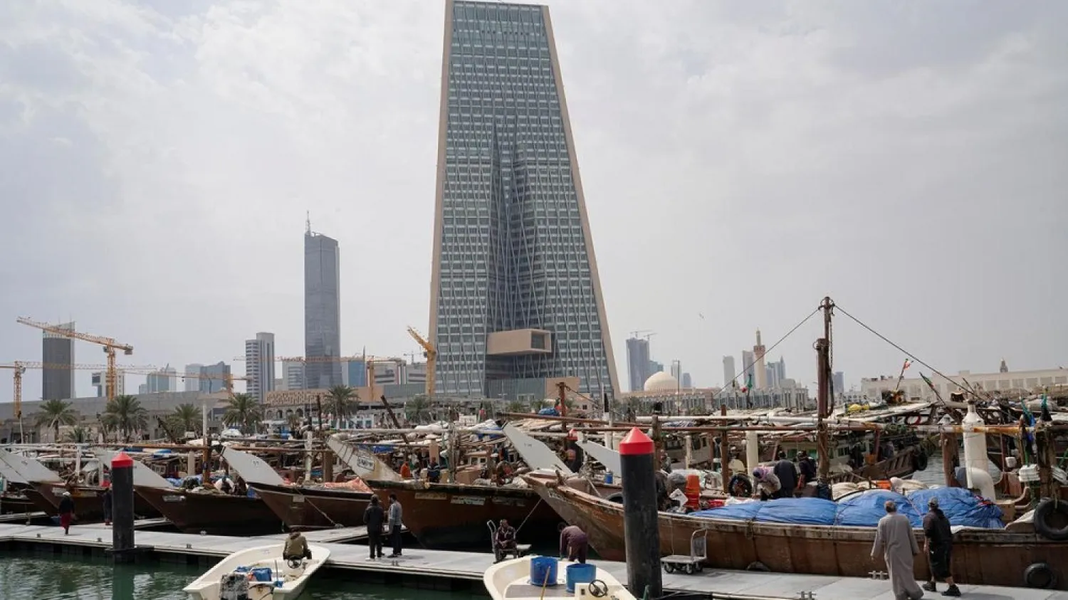 The Kuwait Central Bank towers are pictured over the traditional Dhow harbor. (Reuters.)