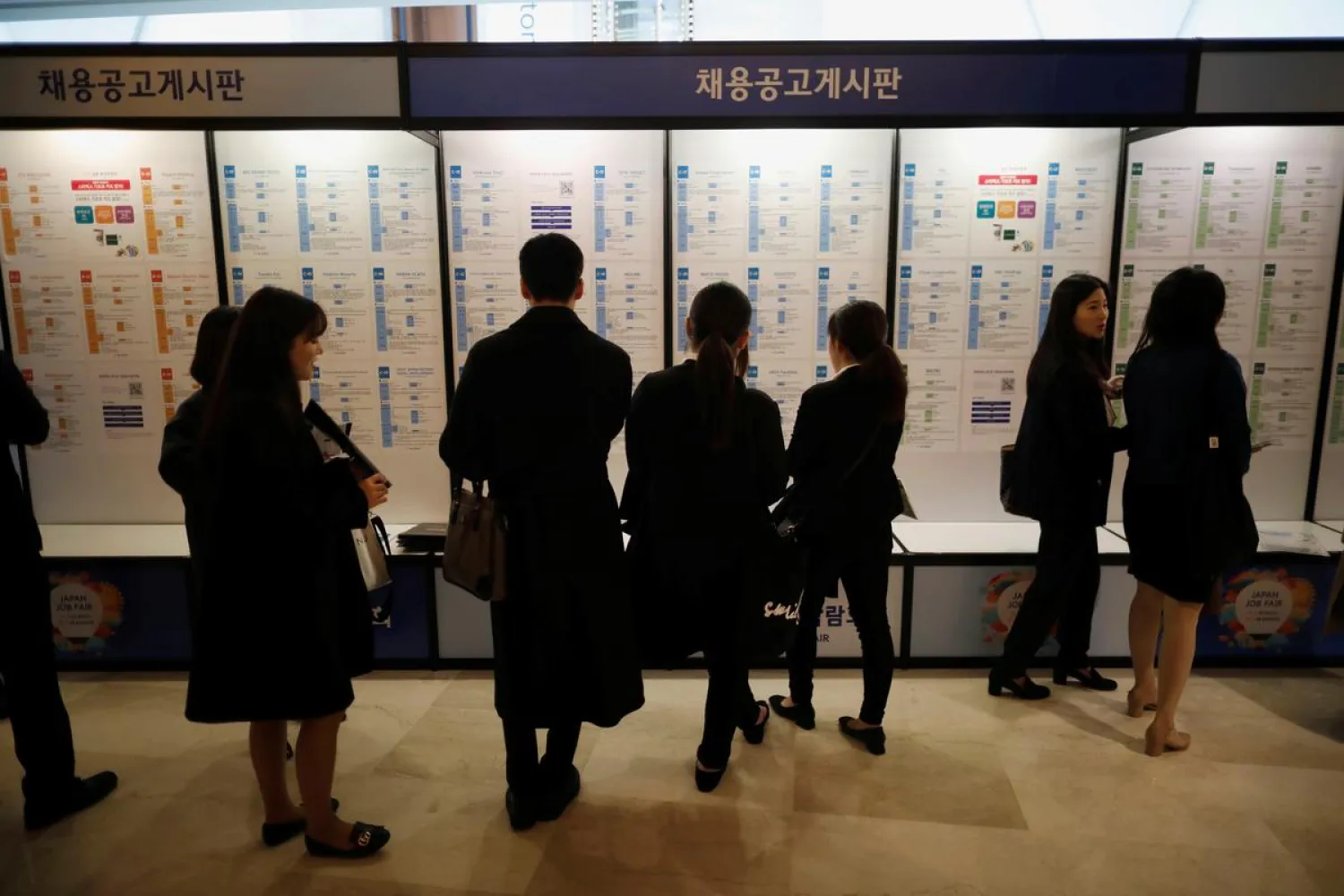 Jobseekers look at recruitment advertisements during the 2018 Japan Job Fair in Seoul, South Korea, November 7, 2018. REUTERS/Kim Hong-Ji
