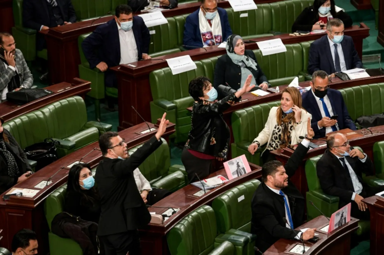 Tunisian lawmakers debate the proposed new cabinet line-up after days of angry protests over police repression and economic hardship | AFP