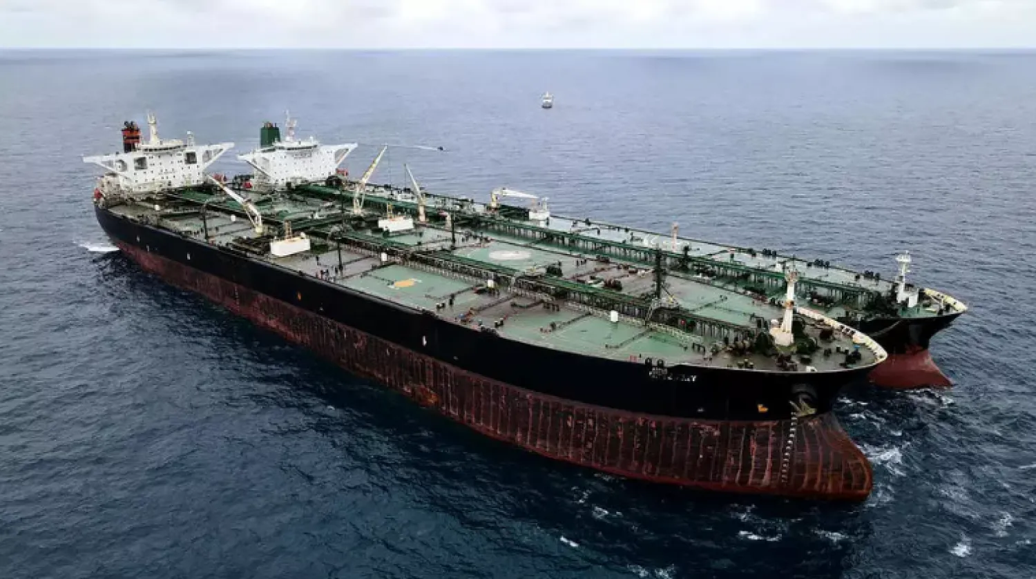 This handout aerial photo taken on January 24, 2021 and released by the Indonesia Coast Guard shows a seized Iranian tanker and Panamanian vessel suspected of illegally transferring oil in Indonesian waters HANDOUT Indonesia Coast Guard/AFP
