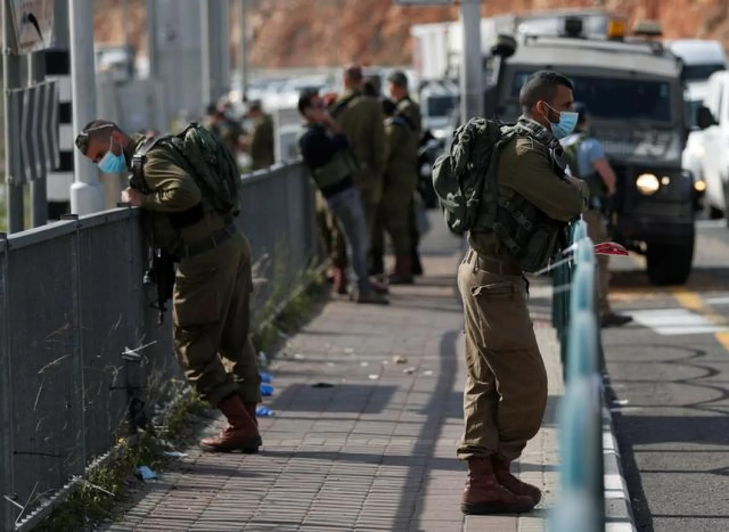 Israel soldiers keep watch at the scene of an incident near the Jewish settlement of Ariel, in the Israeli-occupied West Bank January 26, 2021. REUTERS/Mohamad Torokman
