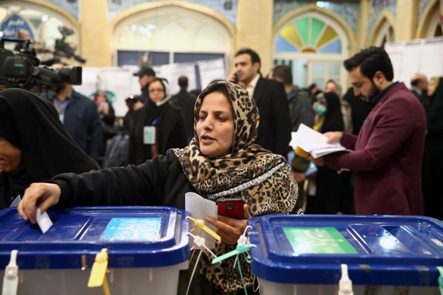 A woman casts her vote during parliamentary elections at a polling station in Tehran (File photo: Reuters)