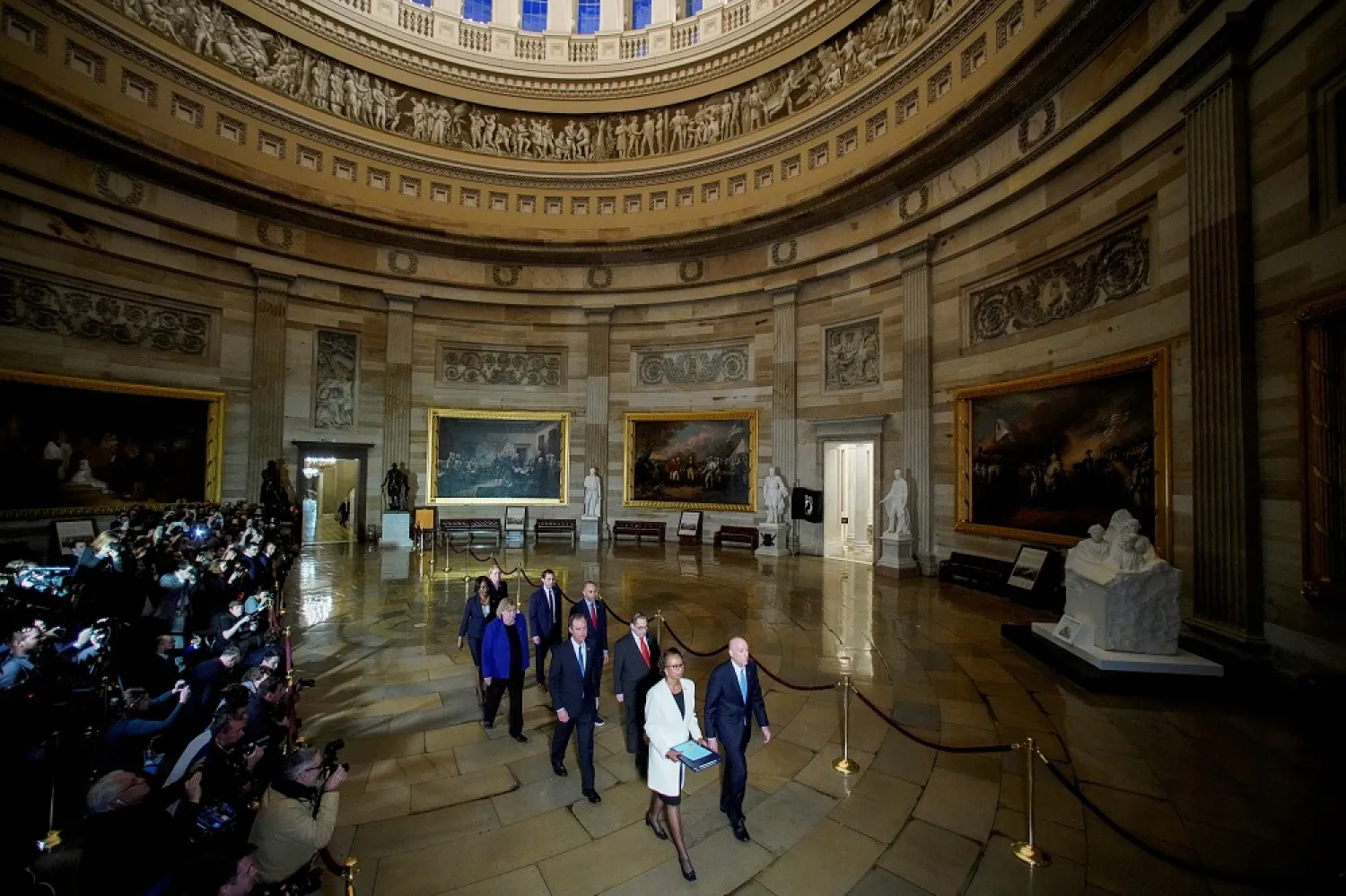 House Sergeant at Arms Paul Irving and House Clerk Cheryl Johnson carry two articles of impeachment against US President Trump during a procession through the US Capitol to the US Senate in Washington, US, Jan. 15, 2020. (Reuters)