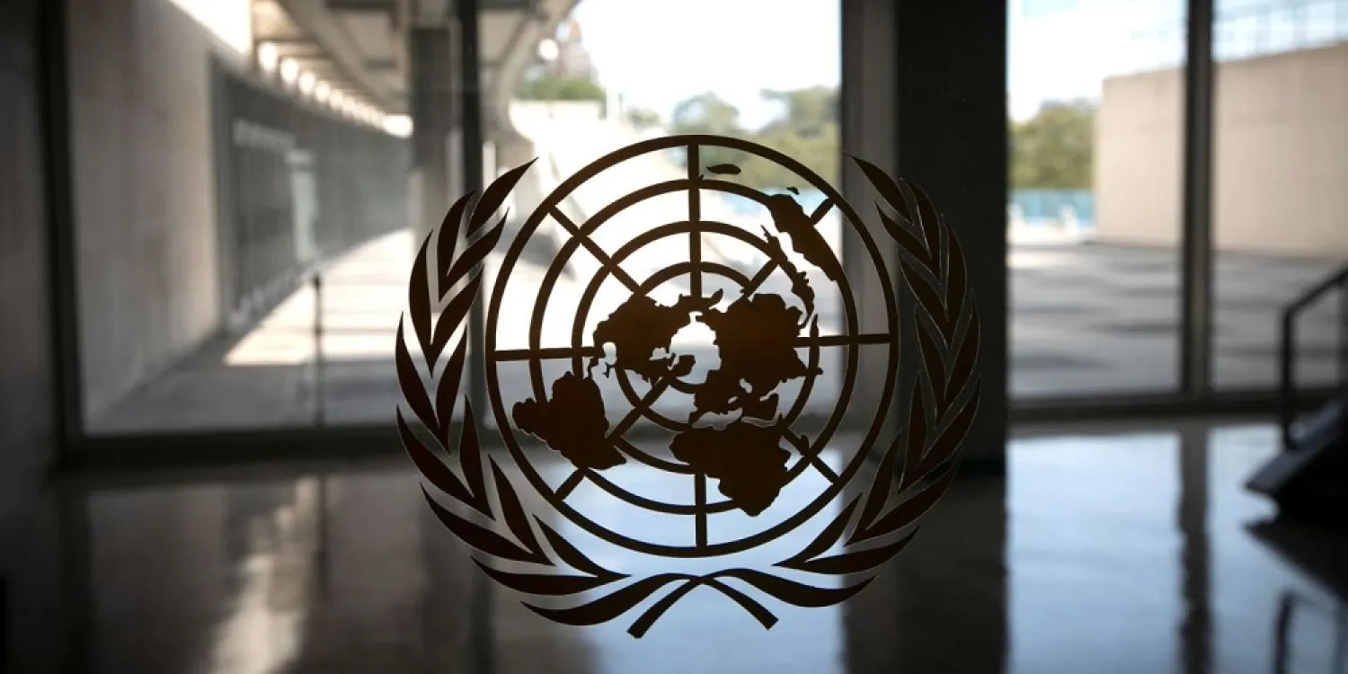 The United Nations logo is seen on a window in an empty hallway at United Nations headquarters in New York, US, September 21, 2020. (Reuters)