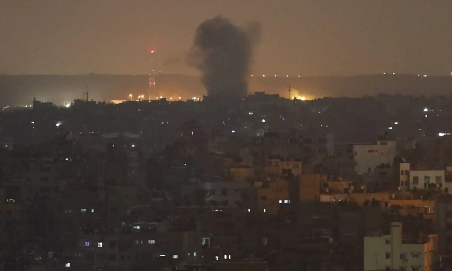An explosion caused by Israeli airstrikes is seen in Gaza City, early Thursday, Nov. 14, 2019. (AP Photo/Adel Hana)
