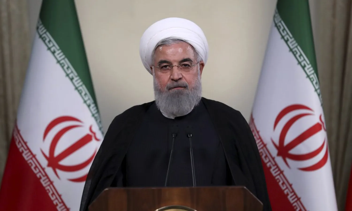 In this photo released by official website of the office of the Iranian Presidency, President Hassan Rouhani addresses the nation in a televised speech in Tehran, Iran, Tuesday, May 8, 2018. " (Iranian Presidency Office via AP)
