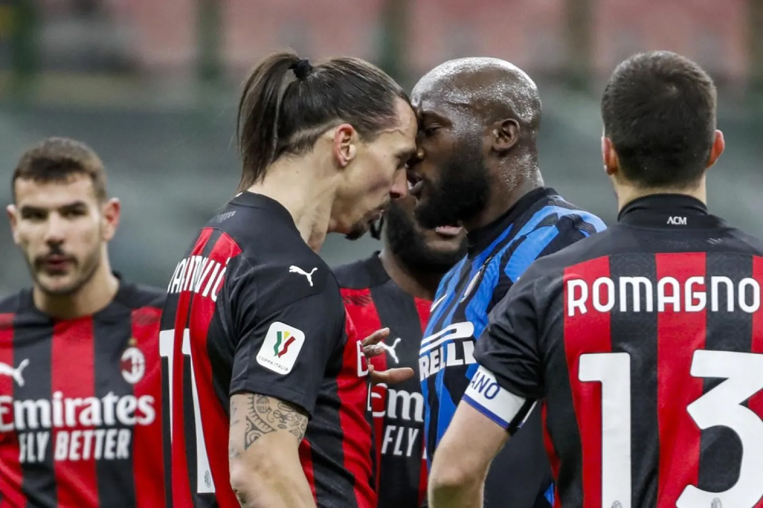 AC Milan's Zlatan Ibrahimovic, center left, and Inter Milan's Romelu Lukaku, center right, argue during an Italian Cup match at the San Siro stadium, in Milan, Italy, Jan. 26, 2021. (AP)