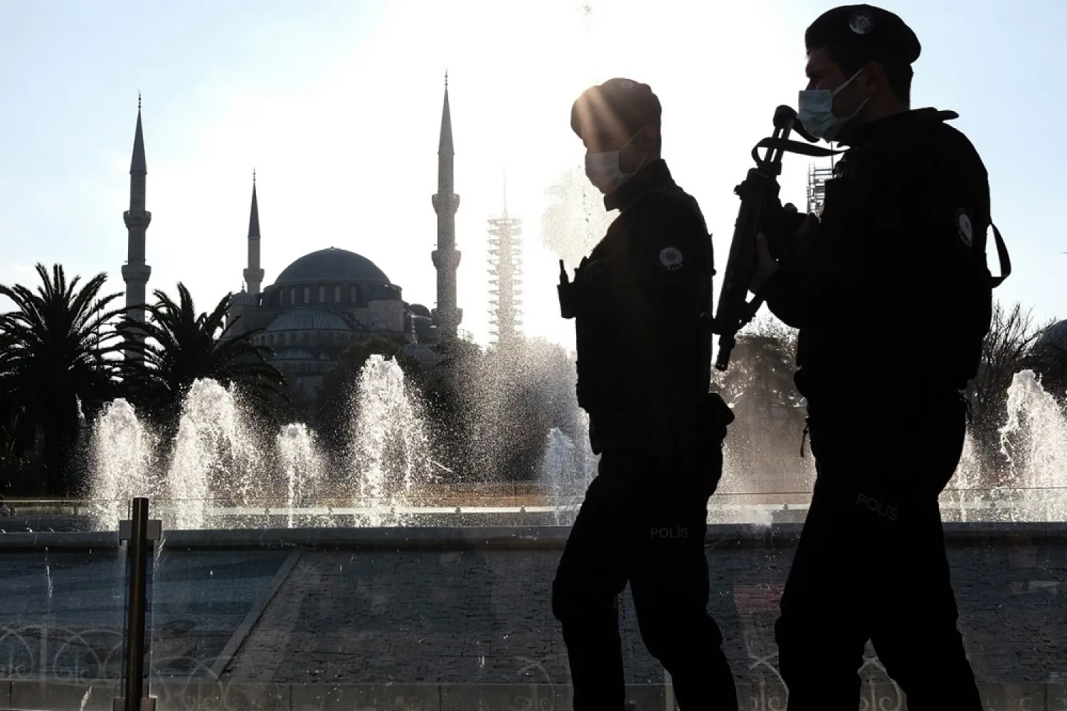 Turkish police wearing face masks as they patrol around the Sultanahmet Mosque in Istanbul, Turkey. (EPA)