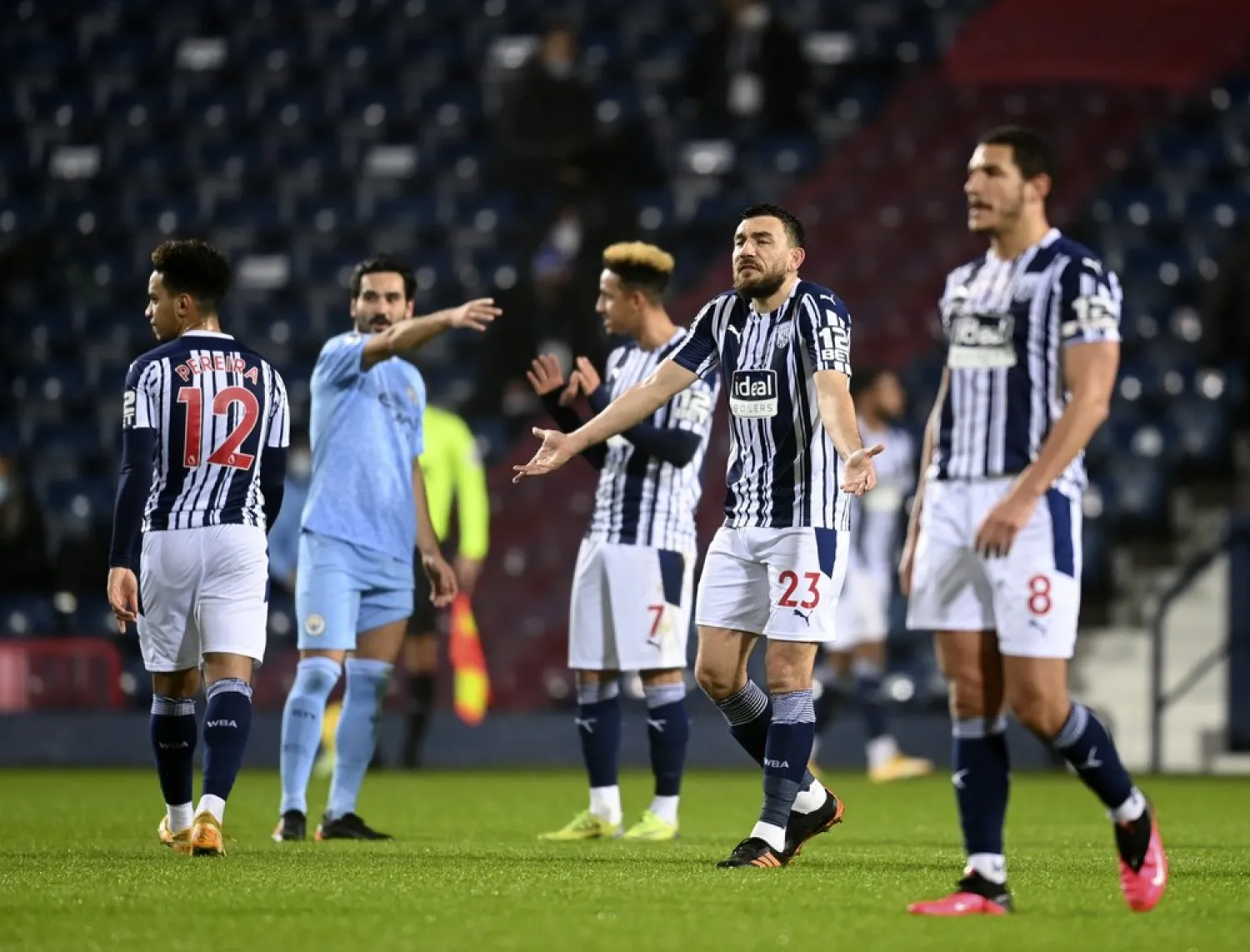 West Bromwich Albion players react after Manchester City's Joao Cancelo scoring his side's second goal during the match at the Hawthorns stadium in West Bromwich, England, Jan. 26, 2021. (AP)