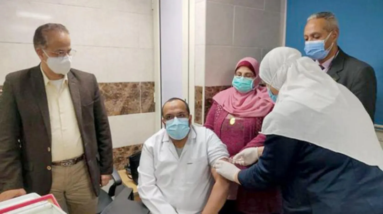 A health worker in Egypt taking COVID-19 vaccine (Ministry of Health) 