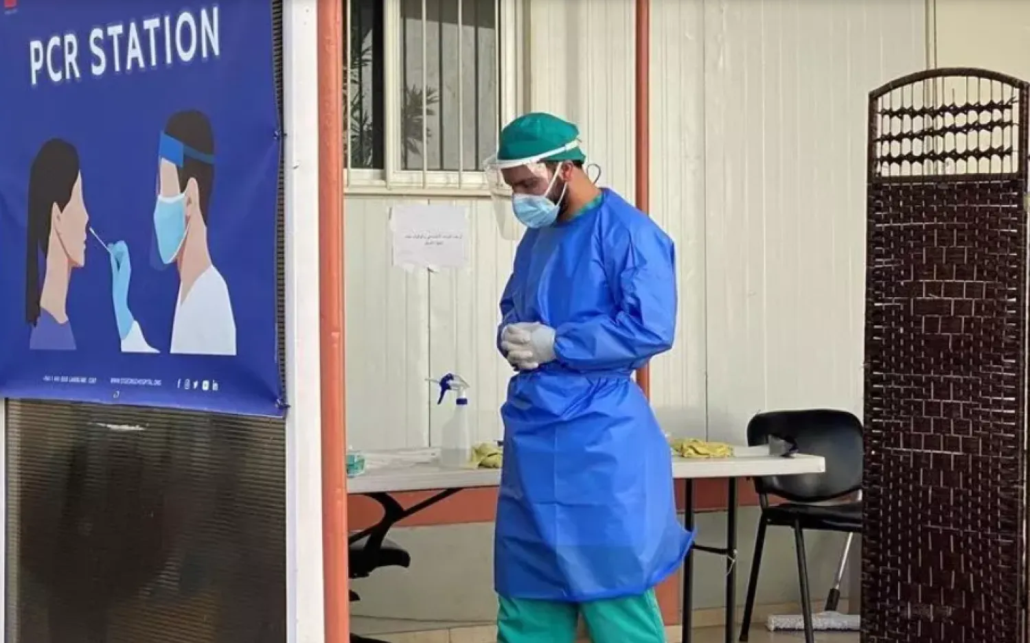 A health worker is pictured at a drive-through coronavirus disease (COVID-19) testing site in Saint George Hospital University Medical center, in Beirut, Lebanon January 15, 2021. Reuters/Ayat Basma