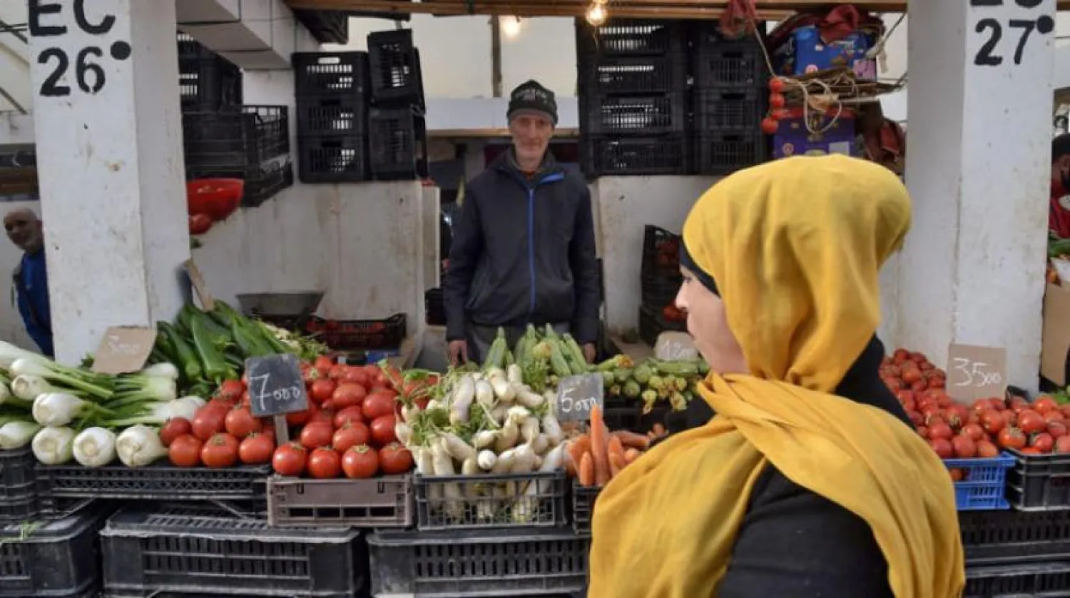 Algerians shop at the produce market in the Bab el-Oued suburb of Algeria's capital Algiers, on January 26, 2021. (Photo by RYAD KRAMDI / AFP)