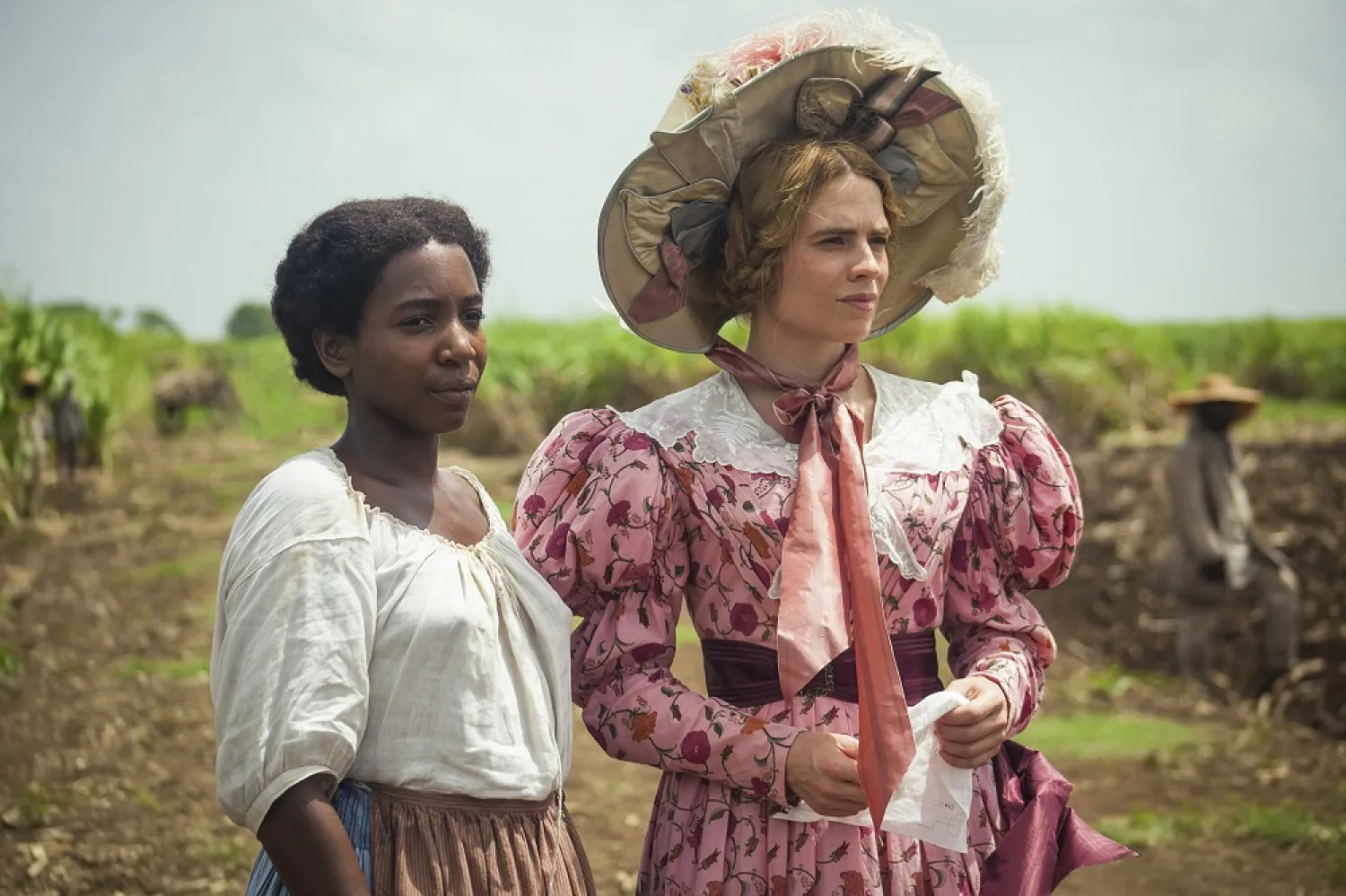 This image released by PBS shows Tamara Lawrance, left, and Hayley Atwell in a scene from the miniseries "The Long Song" debuting Jan. 31 on "Masterpiece." (Heyday Television-PBS via AP)