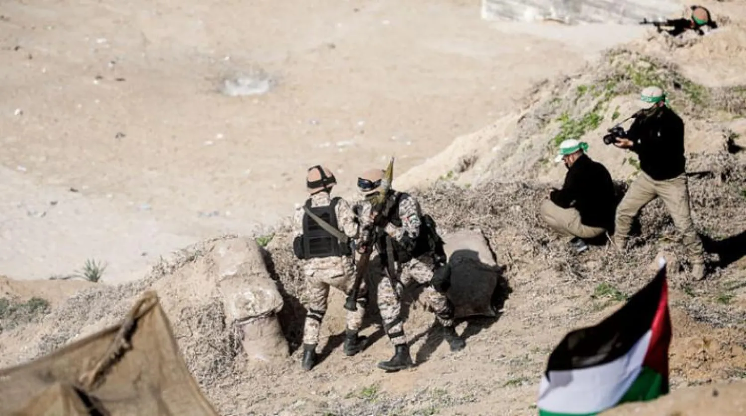 Geçtiğimiz Aralık ayı sonunda Gazze Şeridi’nin güneyinde Kassam Tugayları ve İslami Cihad Hareketi arasında gerçekleştirilen ortak bir askeri tatbikattan bir kare (EPA)