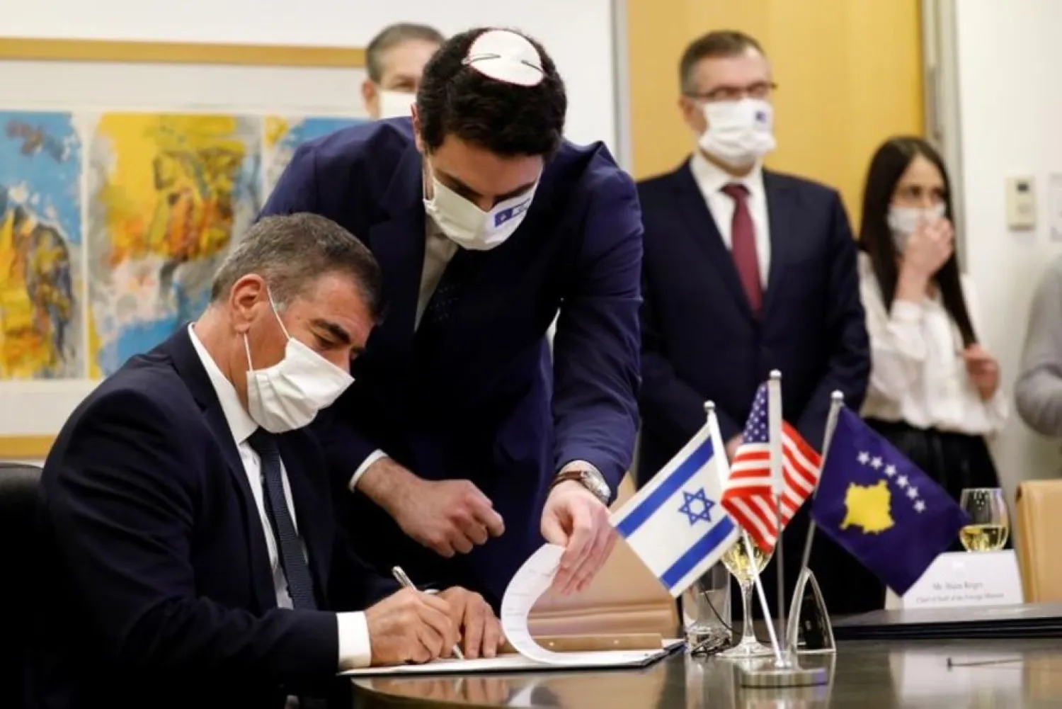 Israel's FM Gabi Ashkenazi signs the agreement establishing diplomatic relations between Israel and Kosovo during a virtual ceremony, in the foreign ministry in Jerusalem February 1, 2021. (Reuters)