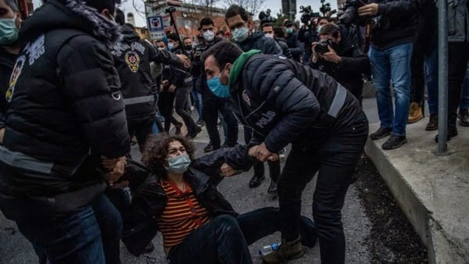 Turkish police detain a woman during a demonstration outside the Bogazici University in Istanbul, on February 1, 2021. (AFP)

