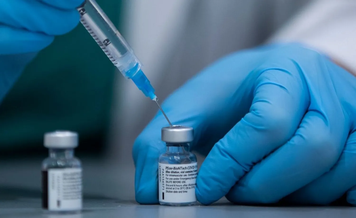 In this Jan. 12, 2021 file photo, a health care professional prepares a Pfizer-BioNTech COVID-19 vaccine at Sheba Tel Hashomer Hospital in Ramat Gan, Israel. (AP)