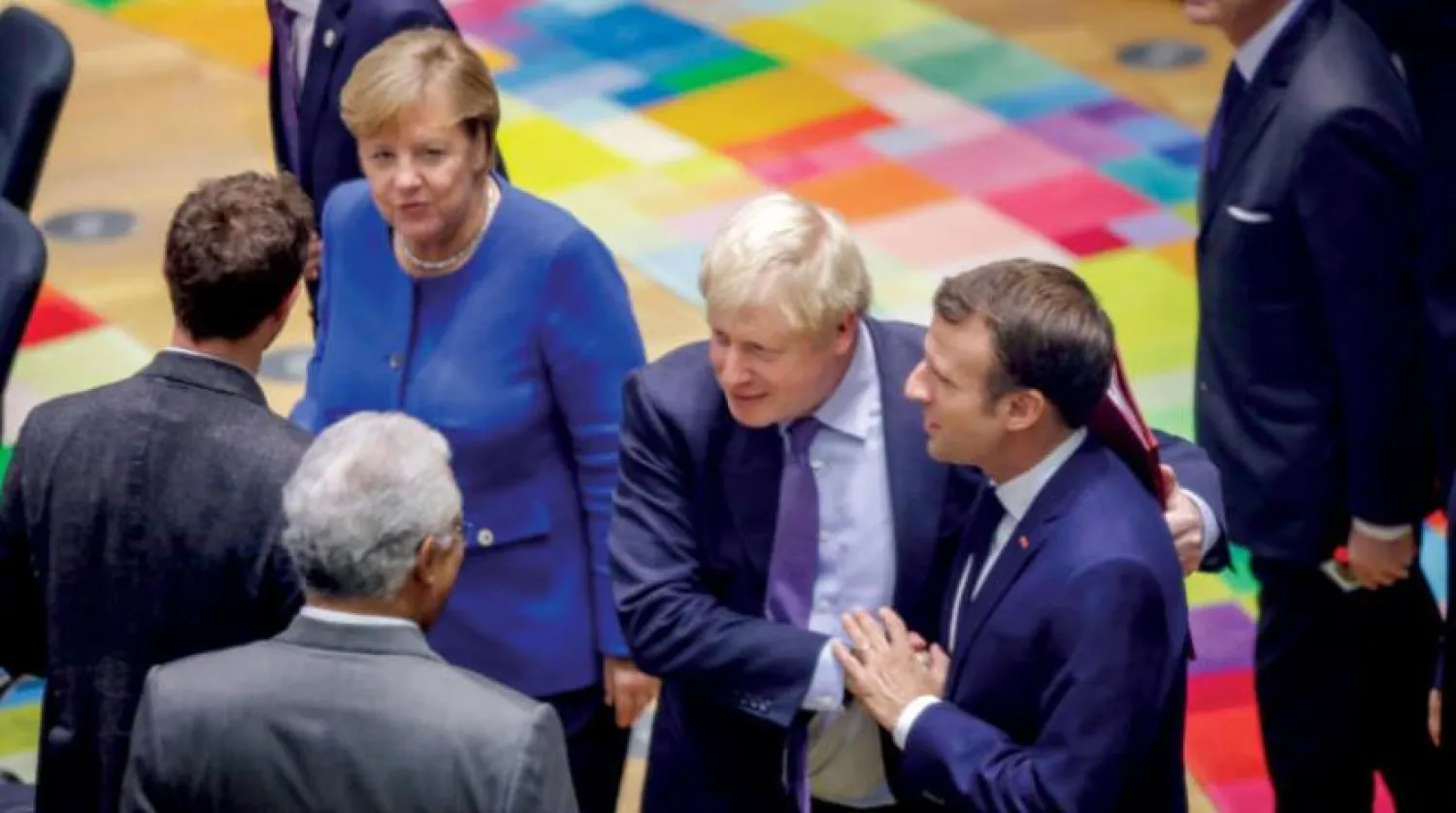 Macron, Johnson ve Merkel, 2019 yılının Ekim ayında Brüksel'de gerçekleştirilen bir toplantıda bir araya geldi (Reuters)