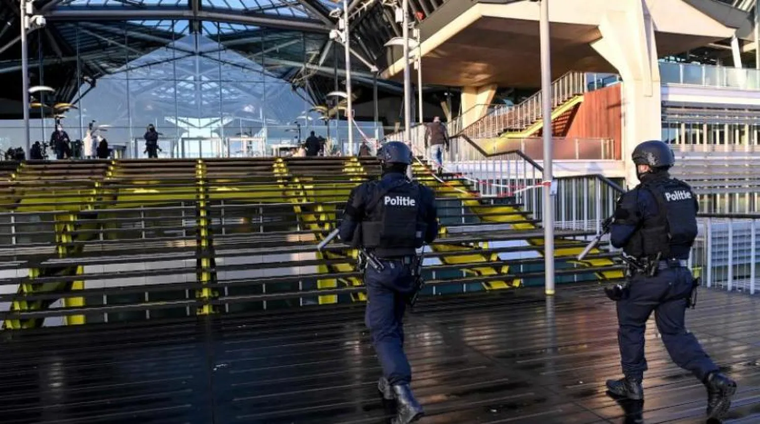 Heavily armed policemen patrol outside the courthouse during the trial of four persons including an Iranian diplomate and Belgian-Iranian couple before the Antwerp criminal court in Antwerp, on February 4, 2021. (Photo by DIRK WAEM / BELGA / AFP)