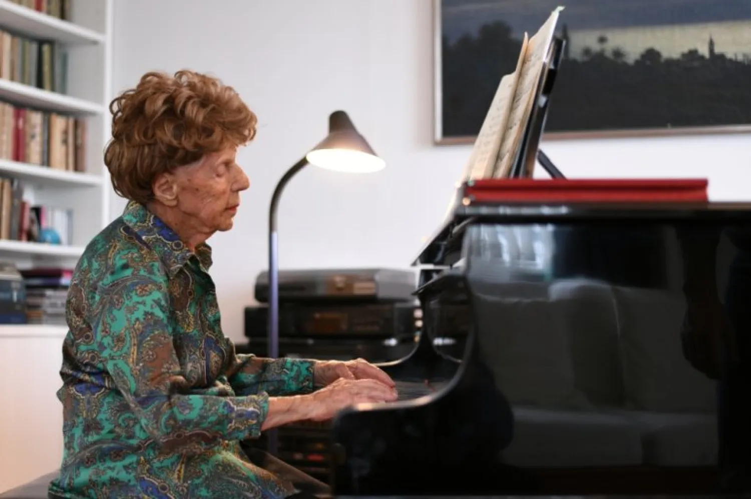 Parisian pianist Colette Maze, 106 years old, plays piano as she poses at her home in Paris, France, February 4, 2021.  REUTERS/Sarah Meyssonnier