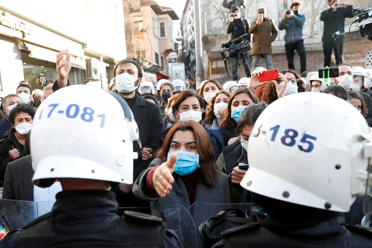 Supporters of the pro-Kurdish Peoples' Democratic Party (HDP), face off police officers as they gather to support Bogazici University students, in Istanbul, Turkey, February 4, 2021. (Reuters)