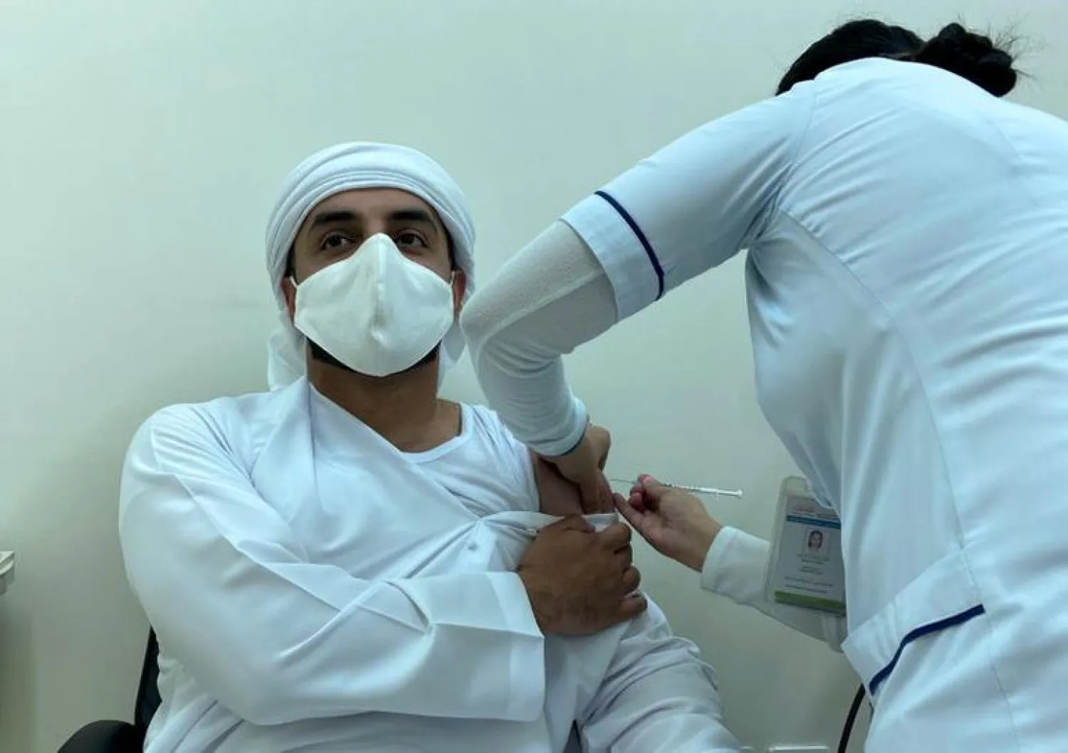 FILE PHOTO: A man receives vaccine against the coronavirus disease (COVID-19), in Dubai, United Arab Emirates December 28, 2020. REUTERS/Abdel Hadi Ramahi
