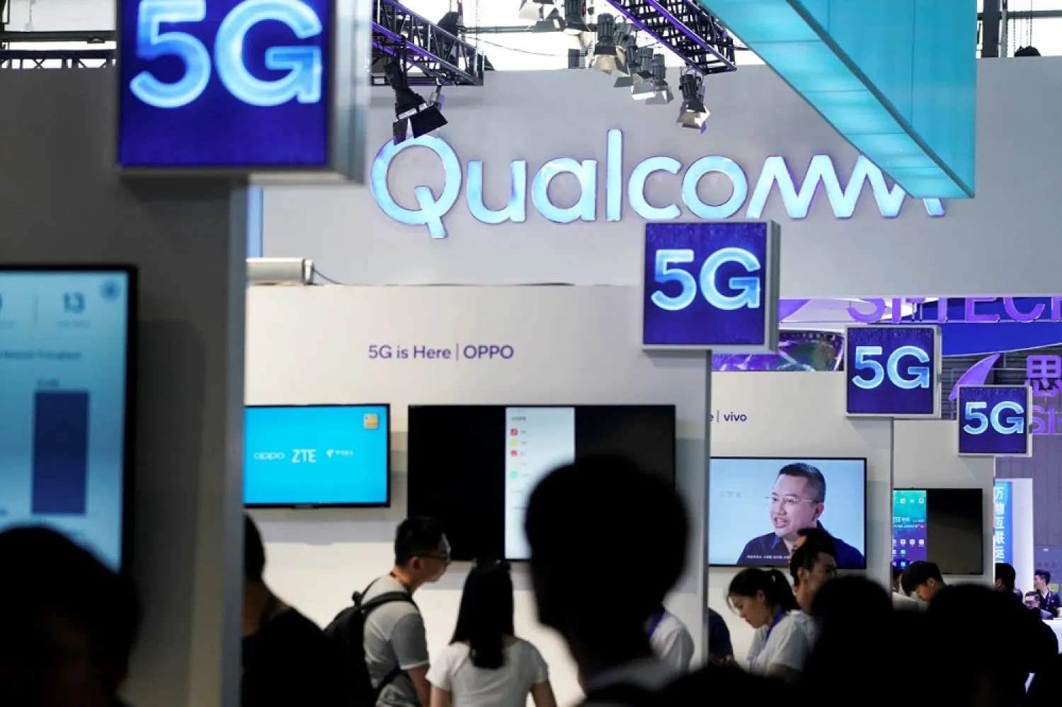 Signs of Qualcomm and 5G are pictured at Mobile World Congress (MWC) in Shanghai, China June 28, 2019. (Reuters)