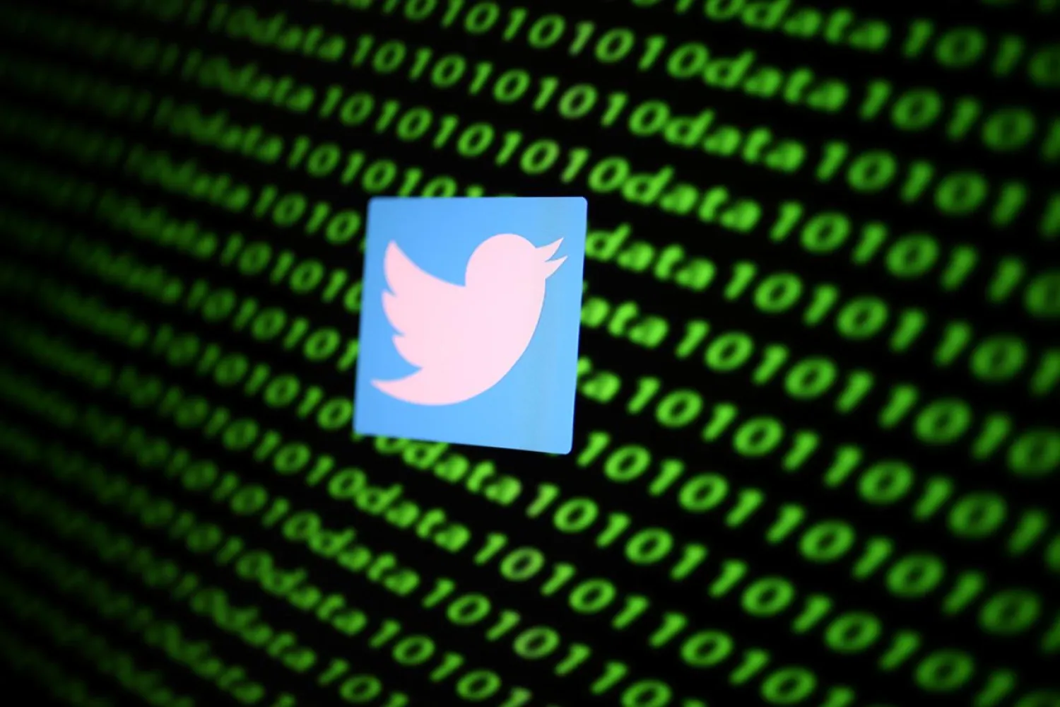 FILE PHOTO: The Twitter logo and binary cyber codes are seen in this illustration taken November 26, 2019. REUTERS/Dado Ruvic/Illustration