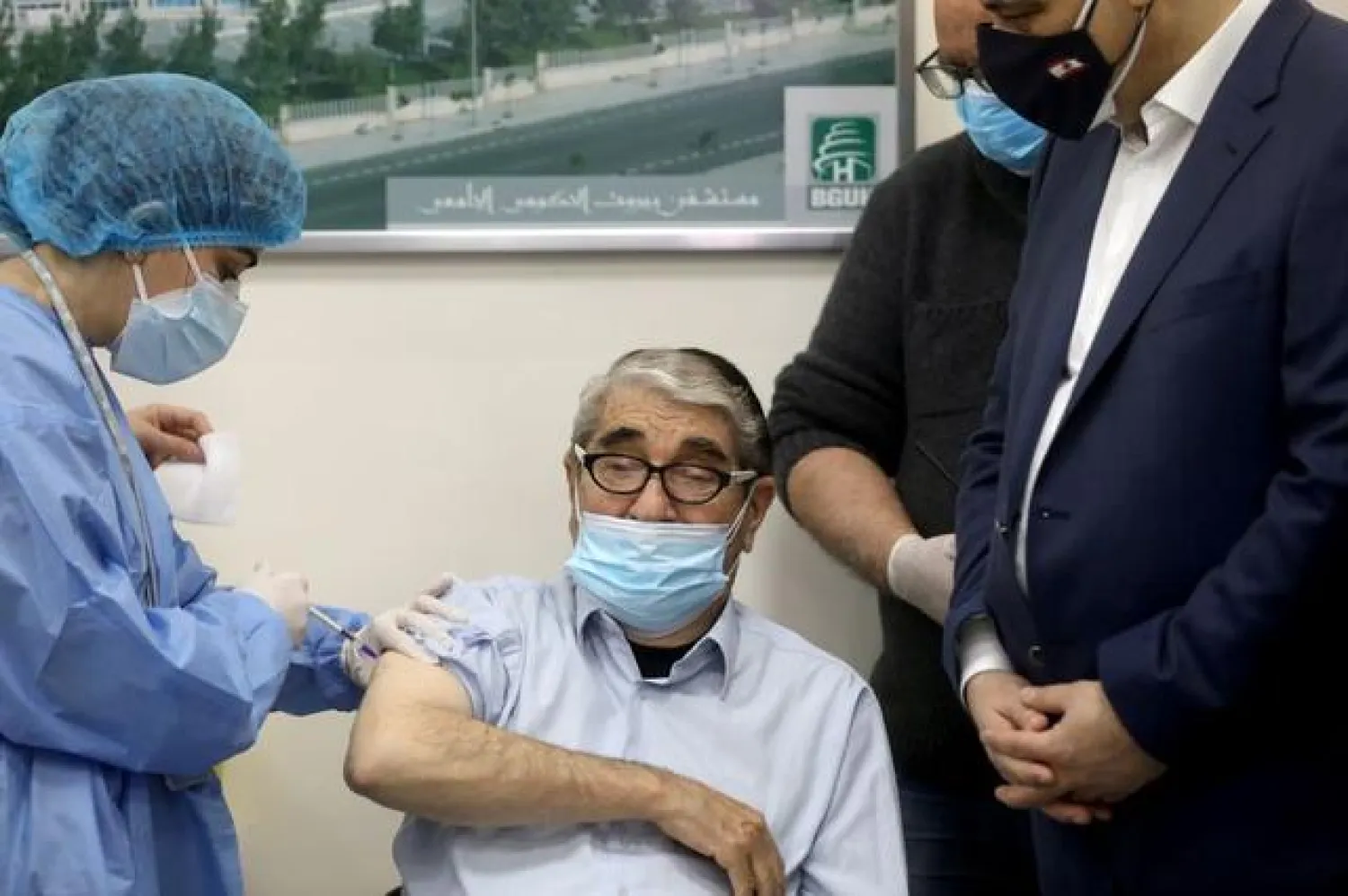 Salah Tizani, 92, known as Abou Salim and one of Lebanon?s first TV celebrities, receives a dose of the Pfizer/BioNTech vaccine against the coronavirus disease (COVID-19) during a coronavirus vaccination campaign at Rafik Hariri University Hospital, in Beirut, Lebanon February 14, 2021. REUTERS/Mohamed Azakir