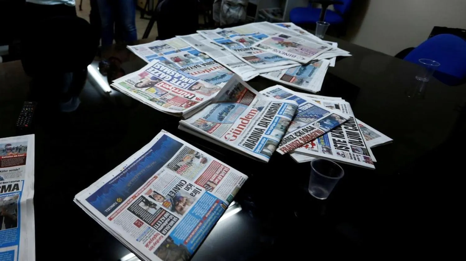 A journalist of Ozgur Gundem gives an interview to a German TV channel at their newsroom before a protest against the arrest of three prominent campaigners for press freedom. (Reuters file photo)