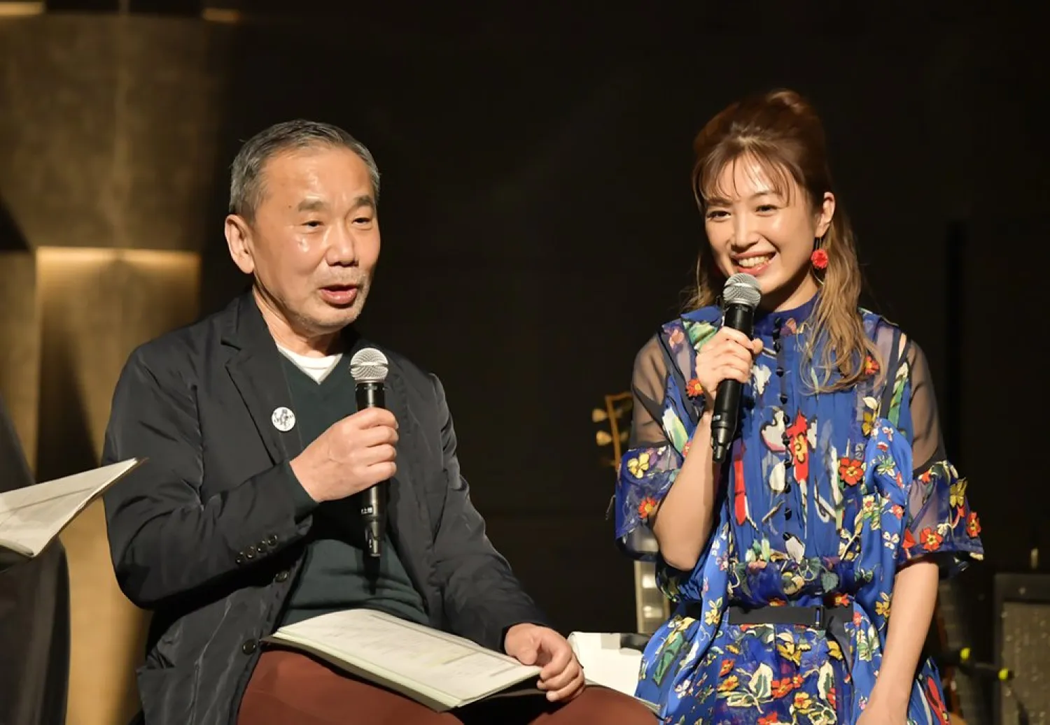 In this photo provided by TOKYO FM, Japanese author Haruki Murakami, left, talks with guitarist Kaori Muraji during a show in Tokyo Sunday, Feb. 14, 2021. (TOKYO FM via AP)