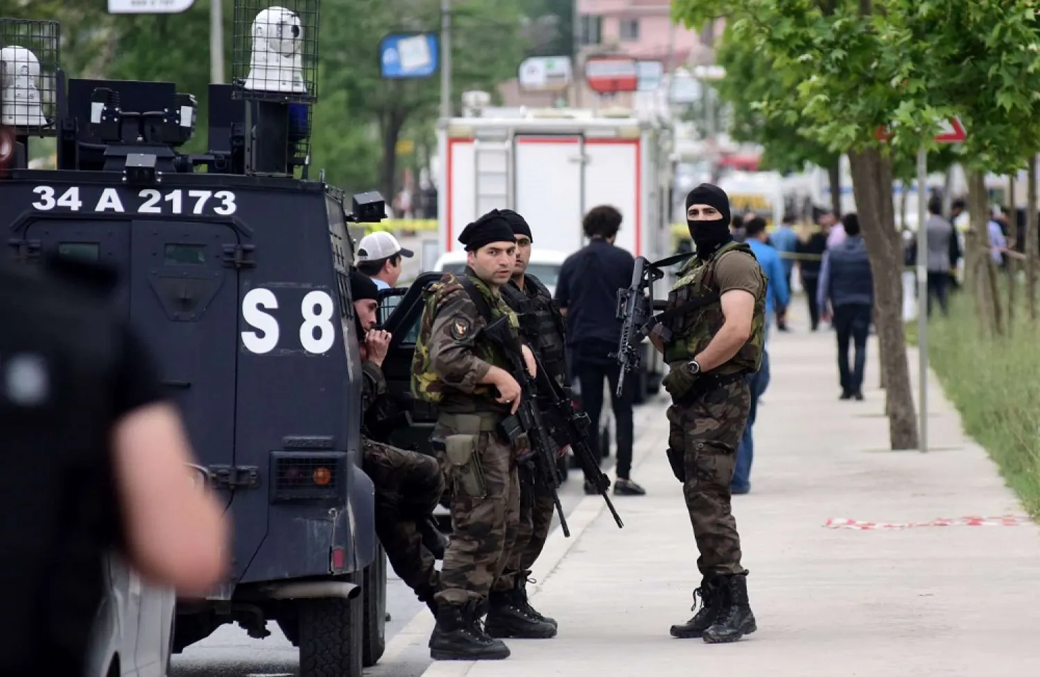 Members of the police special forces stand guard following a vehicle explosion near a military facility in Istanbul, Turkey, on May 12, 2016. (Reuters)