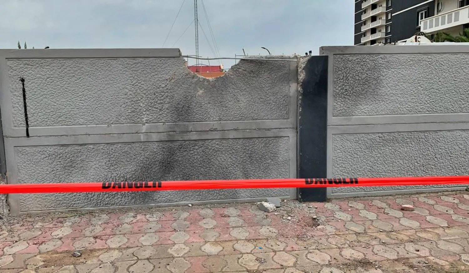 A damaged wall is seen after the rocket attack on US-led forces in and near Erbil International Airport, in Erbil, Iraq February 16, 2021. REUTERS/Azad Lashkari