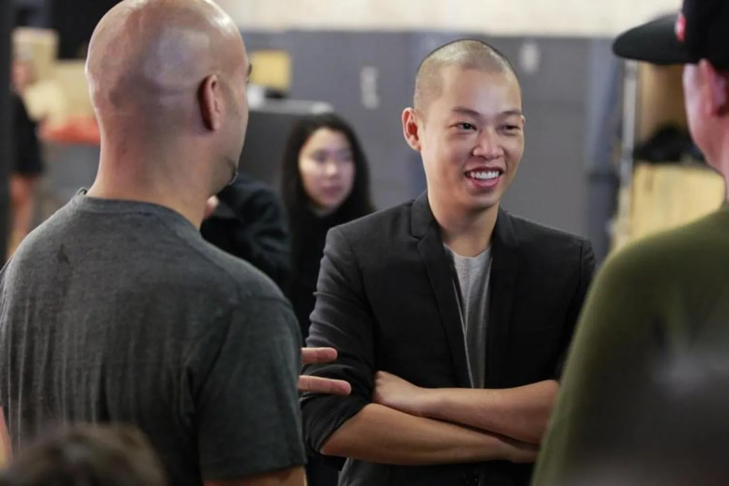 FILE: Designer Jason Wu laughs backstage while preparing to present his Spring/Summer 2014 collection during New York Fashion Week September 6, 2013. REUTERS/Lucas Jackson

