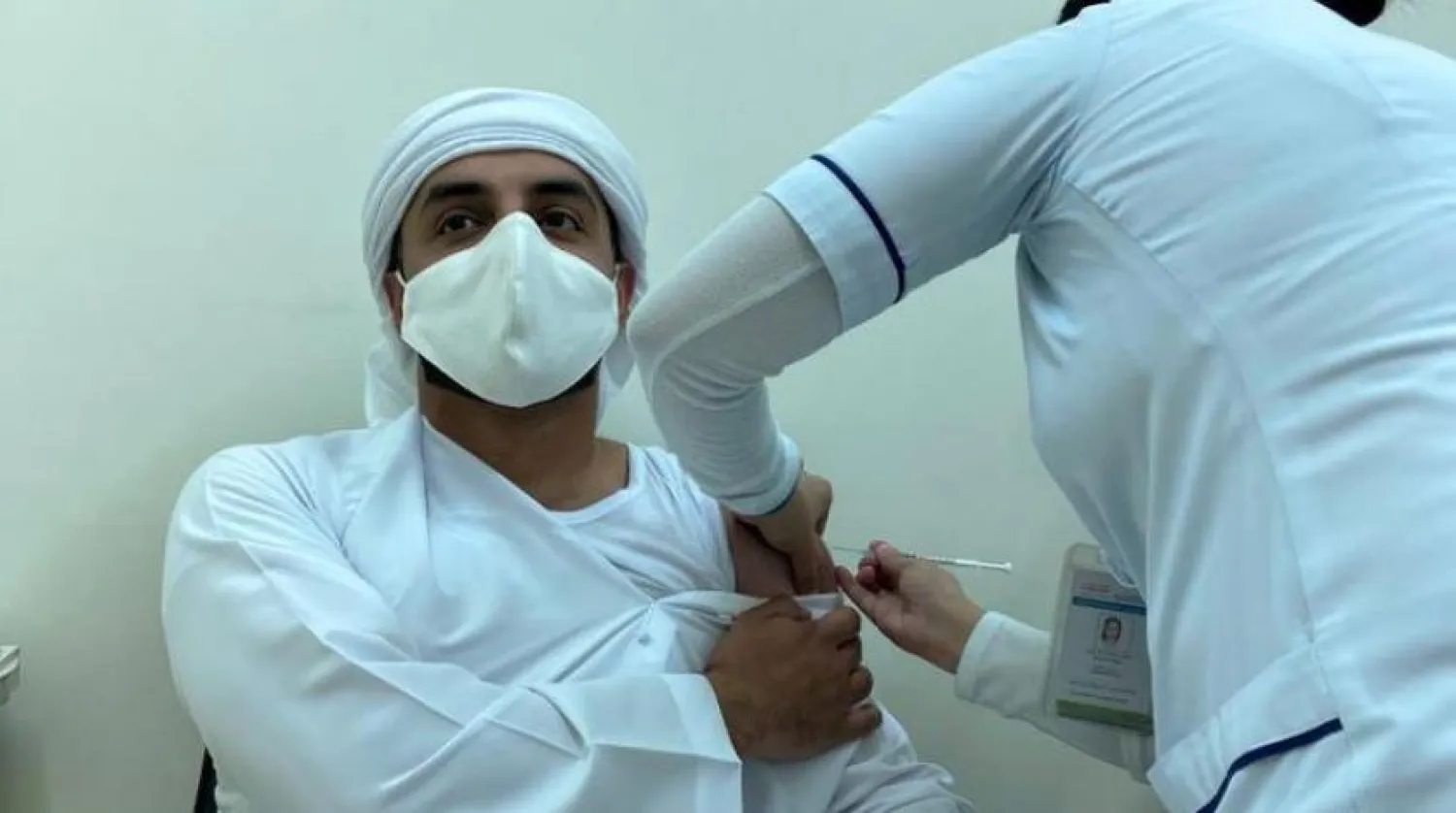 FILE PHOTO: A man receives vaccine against the coronavirus disease (COVID-19), in Dubai, United Arab Emirates December 28, 2020. REUTERS/Abdel Hadi Ramahi
