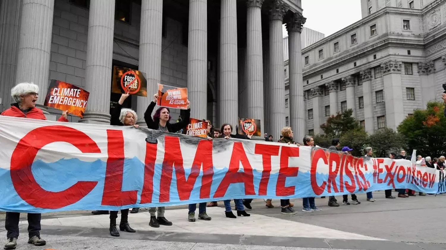 Climate protesters outside a New York court in October 2019 at the start of a trial of Exxon Mobil. (AFP)