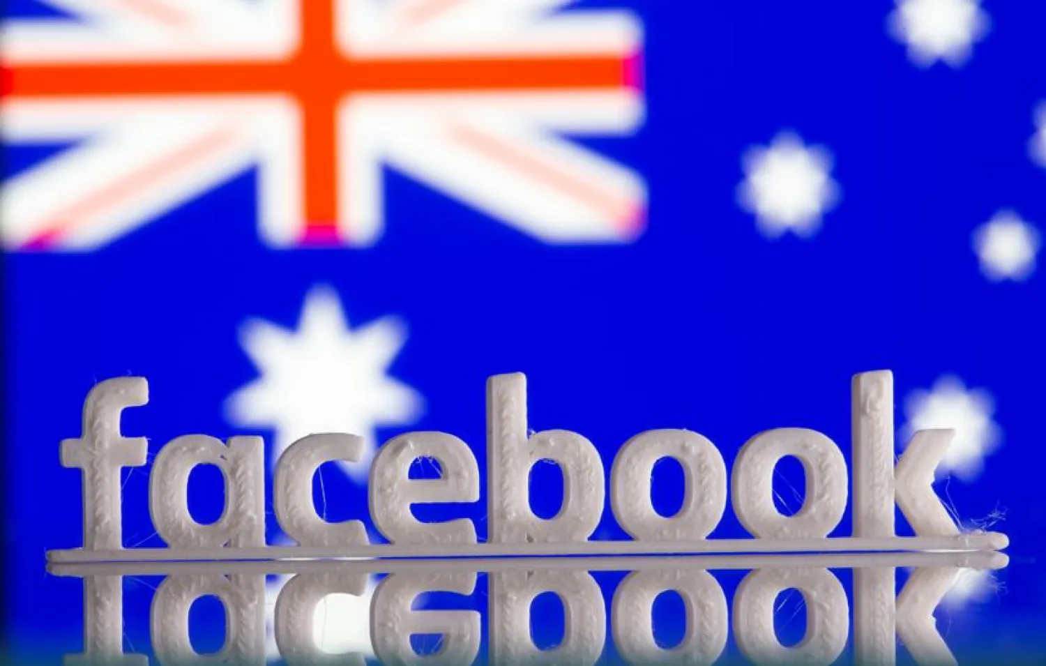 FILE PHOTO: A 3D printed Facebook logo is seen in front of displayed Australia's flag in this illustration photo taken February 18, 2021. REUTERS/Dado Ruvic/Illustration