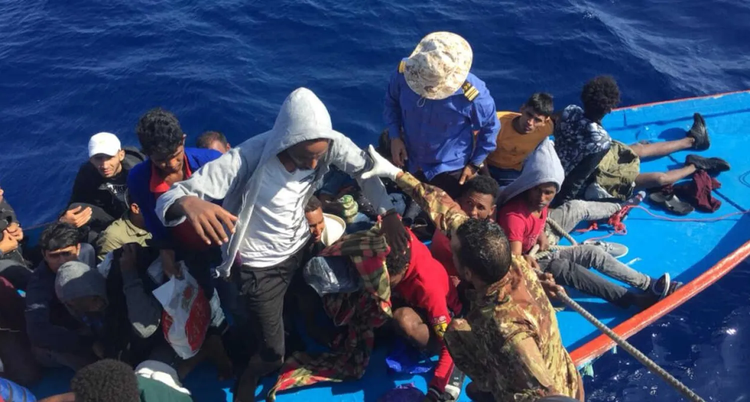 FILE - Migrants in a dinghy are rescued by the Libyan coast guard in the Mediterranean Sea off the coast of Libya, Oct. 18, 2019. Reuters
